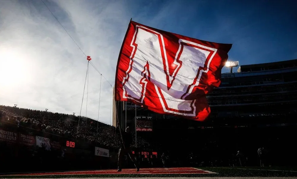 A Nebraska Cornhuskers flag waves after a score during a game at Memorial Stadium.