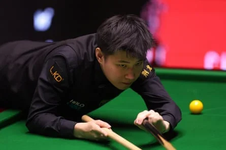 Zhao Xintong plays a shot during his quarter-final defeat by Shaun Murphy
